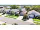 Aerial view of a residential neighborhood, showcasing the manicured lawns and beautiful landscaping at 16620 Fairbolt Way, Odessa, FL 33556