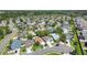 An attractive aerial view of a neighborhood boasting well-kept homes, verdant landscaping, and winding streets at 16620 Fairbolt Way, Odessa, FL 33556