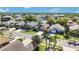 Aerial view of a residential neighborhood, showcasing the manicured lawns and beautiful landscaping at 16620 Fairbolt Way, Odessa, FL 33556