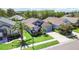 Aerial view of a residential neighborhood, showcasing the manicured lawns and beautiful landscaping at 16620 Fairbolt Way, Odessa, FL 33556