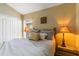 Inviting bedroom featuring neutral tones, comfortable bedding, and stylish decor accents, perfect for relaxation at 16620 Fairbolt Way, Odessa, FL 33556
