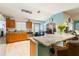 Eat-in kitchen featuring wooden cabinets, granite countertops and stainless steel appliances at 16620 Fairbolt Way, Odessa, FL 33556