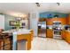 Spacious kitchen with wooden cabinets, granite countertops, and stainless steel appliances at 16620 Fairbolt Way, Odessa, FL 33556