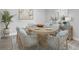 Elegant dining room featuring a wood table with seating for eight and stylish decor at 1724 Sunset Preserve Way, Port Charlotte, FL 33953