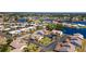 Beautiful aerial view of the community with waterfront homes and mature trees at 1770 Lake Pl # 1770D, Venice, FL 34293