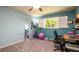 Comfortable bedroom with soft carpet, plenty of light, and space to meet your work and exercise needs at 1770 Lake Pl # 1770D, Venice, FL 34293
