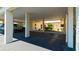 Open carport featuring ample space for parking and shade, with access to the home's entryway at 1770 Lake Pl # 1770D, Venice, FL 34293