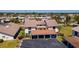Condominium featuring carport parking, tidy landscaping, and abundant green space at 1770 Lake Pl # 1770D, Venice, FL 34293