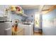 Practical laundry room with modern washer and dryer, utility sink, and storage shelves at 1770 Lake Pl # 1770D, Venice, FL 34293