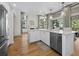Bright open kitchen with white cabinets, granite countertops, and stainless steel appliances at 1928 Harbourside Dr # 1404, Longboat Key, FL 34228