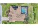 Overhead view of a home with a tile roof and screened pool area at 1975 White Feather Ln, Nokomis, FL 34275