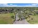 Picturesque community entrance featuring lush landscaping, stone waterfalls, and mature palm trees at 1975 White Feather Ln, Nokomis, FL 34275