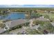 Community clubhouse situated by a serene lake, offering picturesque views and leisure activities at 1975 White Feather Ln, Nokomis, FL 34275