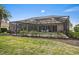 Enclosed backyard pool area with lush landscaping at 1975 White Feather Ln, Nokomis, FL 34275