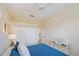This bedroom features a ceiling fan and a full sized closet with doors, ideal for storage and organization at 1975 White Feather Ln, Nokomis, FL 34275