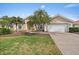 Charming home with a well-kept lawn, a paved driveway, and mature trees at 1975 White Feather Ln, Nokomis, FL 34275