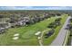 Well-maintained golf course featuring lush green fairways, sand traps, and manicured putting greens at 1975 White Feather Ln, Nokomis, FL 34275