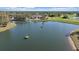 Picturesque golf course with a scenic pond, well-maintained greens and lush fairways at 1975 White Feather Ln, Nokomis, FL 34275