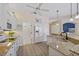 Spacious kitchen with white cabinets, granite countertops, and modern appliances at 1975 White Feather Ln, Nokomis, FL 34275