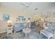 Bright and airy living room with comfortable seating open to kitchen and dining area at 1975 White Feather Ln, Nokomis, FL 34275