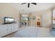 Bright bedroom with a sliding glass door leading to the patio, a walk-in closet, and an ensuite bathroom at 203 Winding River Trl, Bradenton, FL 34212