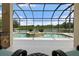 Relax on this covered patio with spa and expansive lake views at 203 Winding River Trl, Bradenton, FL 34212