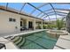 Stunning screened pool features a spa, steps and a covered patio for relaxing at 203 Winding River Trl, Bradenton, FL 34212