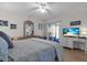 Bedroom featuring a ceiling fan, TV and access to an outdoor area at 204 46Th Avenue W Ter # 412, Bradenton, FL 34207