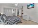 Comfortable bedroom features a television, ample closet space, and light hardwood flooring at 204 46Th Avenue W Ter # 412, Bradenton, FL 34207