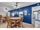 Dining room with a blue accent wall at 204 46Th Avenue W Ter # 412, Bradenton, FL 34207