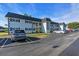 Bright condo complex with black shutters, well-maintained landscaping and ample parking at 204 46Th Avenue W Ter # 412, Bradenton, FL 34207