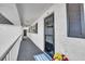Condo hallway with flowers and a welcome mat near the front door at 204 46Th Avenue W Ter # 412, Bradenton, FL 34207