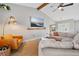 Bright living room featuring comfortable seating, tile floors, and a view of the water at 2457 Appaloosa Cir, Sarasota, FL 34240