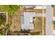 Aerial view of a well-maintained single-Gathering home featuring a landscaped yard and a traditional roof design at 2620 White Sands Dr, Sarasota, FL 34231