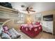 Bedroom featuring bunk beds, a double bed, tiled flooring, and plenty of natural light from two windows at 2620 White Sands Dr, Sarasota, FL 34231
