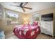 Bedroom featuring a double bed, tiled flooring, and plenty of natural light from two windows at 2620 White Sands Dr, Sarasota, FL 34231