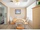 Bright dining area with a round table, six chairs, tile floors, and access to the kitchen at 2620 White Sands Dr, Sarasota, FL 34231