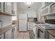 Bright kitchen with white cabinets, ample counter space, and modern appliances at 2620 White Sands Dr, Sarasota, FL 34231