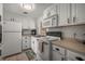 Efficient kitchen featuring white cabinets, ample counter space, and modern appliances at 2620 White Sands Dr, Sarasota, FL 34231