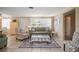 Inviting living room with tile floors, natural light, comfortable seating, and stylish decor at 2620 White Sands Dr, Sarasota, FL 34231