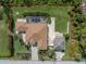 Aerial view of the property featuring a pool, fenced in back yard, and beautiful landscaping at 2629 Rolling Rd, North Port, FL 34288