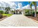 Beautiful home exterior with a large driveway, well-maintained landscaping, and a two-car garage at 2629 Rolling Rd, North Port, FL 34288