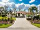 Beautiful single-story home featuring a paver driveway, well-manicured landscaping, and a charming front entrance at 2629 Rolling Rd, North Port, FL 34288