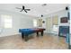 Game room features a pool table, recessed lighting, and access to the patio at 2629 Rolling Rd, North Port, FL 34288