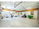 Spacious garage with epoxy flooring, pegboard walls and high ceilings for ample storage at 2629 Rolling Rd, North Port, FL 34288
