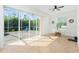 Bright lanai features large sliding doors leading to a pool and outdoor seating area at 2629 Rolling Rd, North Port, FL 34288