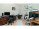 Office space with tile floors, two desks, and natural light at 2629 Rolling Rd, North Port, FL 34288