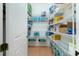Pantry featuring tile flooring and white wire shelving for organized storage at 2629 Rolling Rd, North Port, FL 34288
