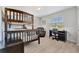 Functional bedroom with a bunk bed, a desk, and ample natural light, ideal for a room or guest space at 2916 Woodcrest Dr, Sarasota, FL 34239