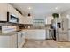 Bright kitchen featuring white cabinets, stainless steel appliances, and granite countertops at 2916 Woodcrest Dr, Sarasota, FL 34239